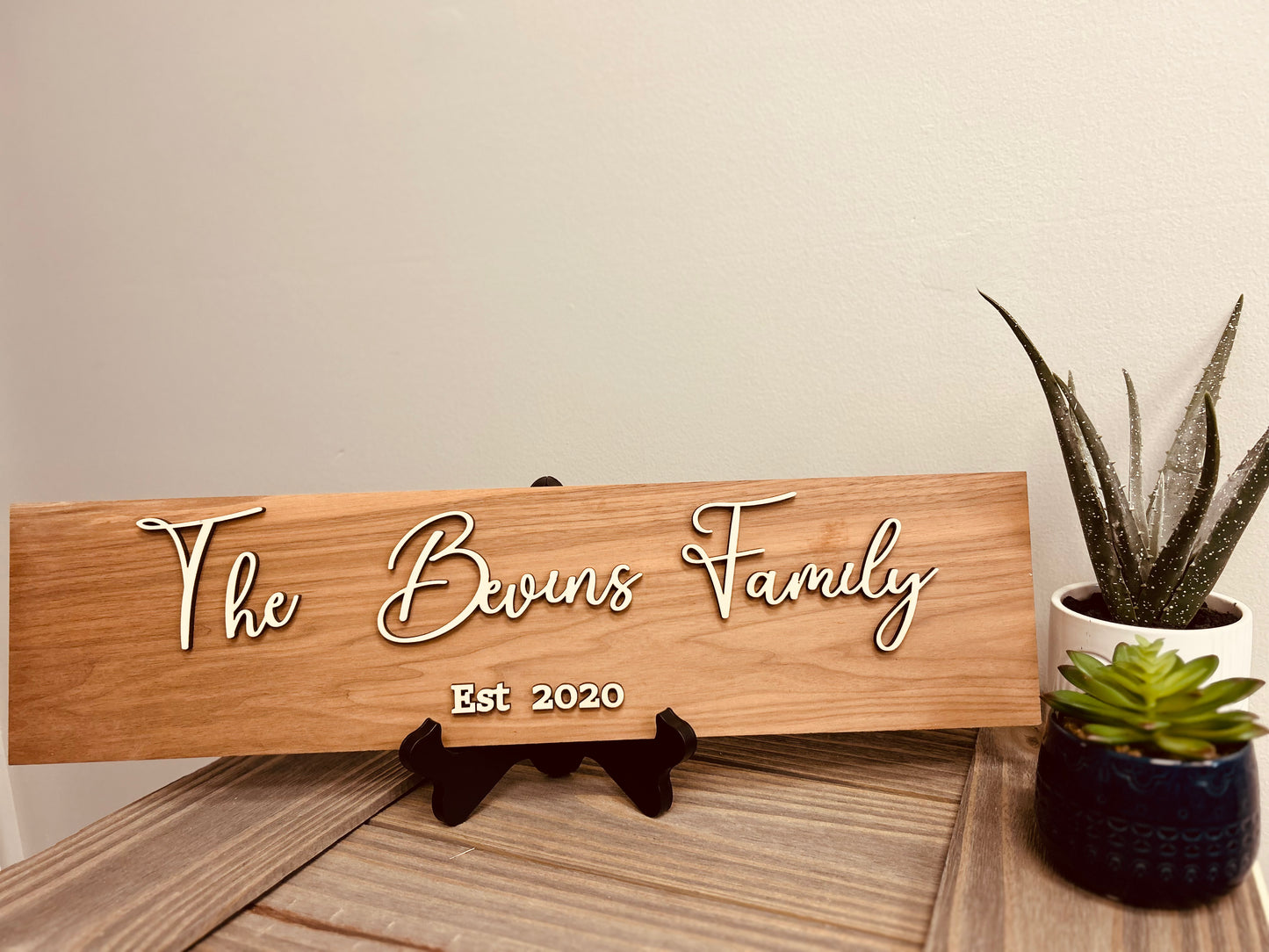Personalized walnut wood sign with engraved lettering – rustic home decor or business signage.