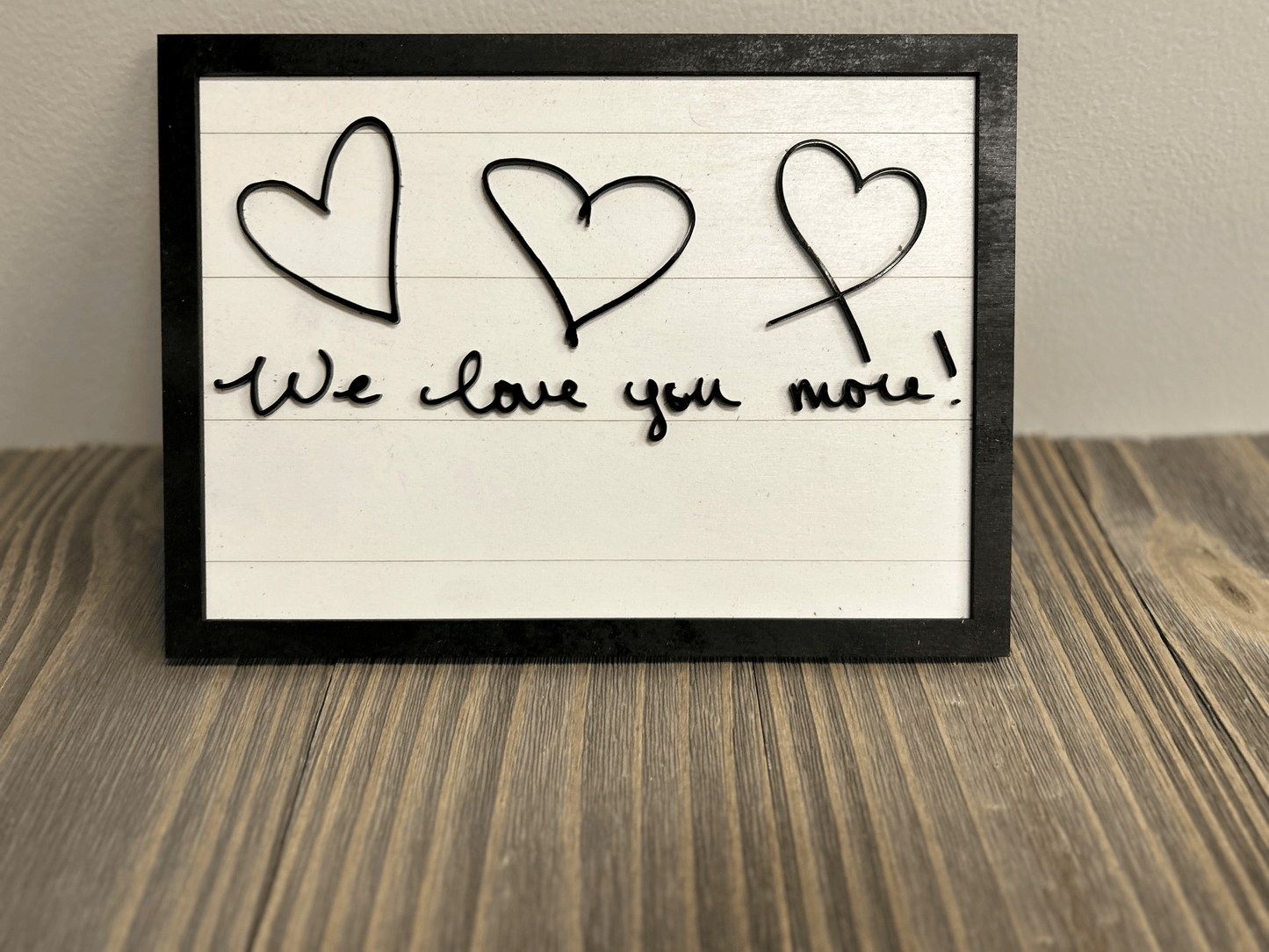 A bold and dynamic handwritten signature with smooth curves and strong acrylic strokes