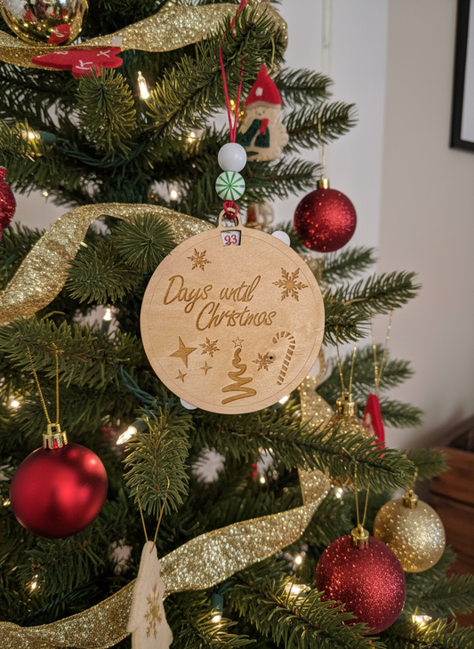 Wooden Christmas countdown ornament on decorated Christmas tree with red and gold baubles