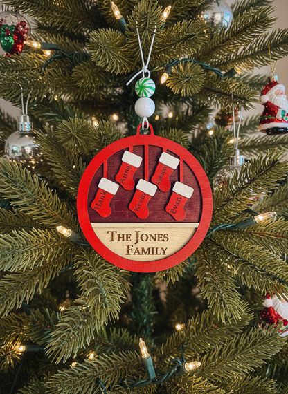 Personalized family Christmas ornament with red stockings on Christmas tree