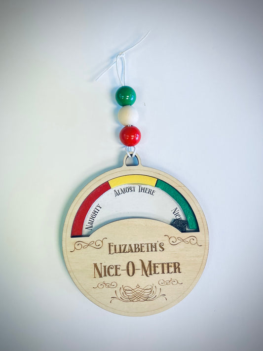 Wooden Nice-O-Meter ornament with colorful beads, labeled Naughty, Almost There, Nice.