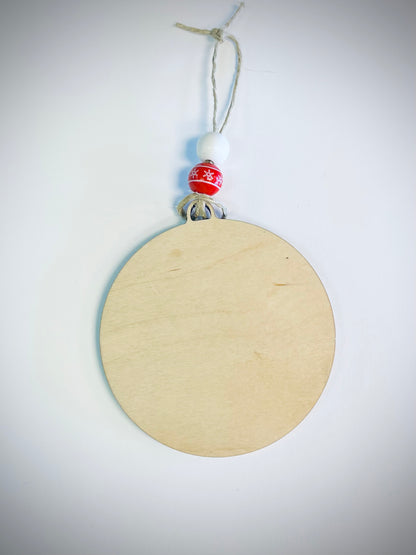 Blank wooden Christmas ornament with white and red snowflake beads on twine hanger