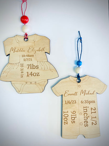 Personalized wooden baby onesie ornaments with custom birth details and colorful beads
