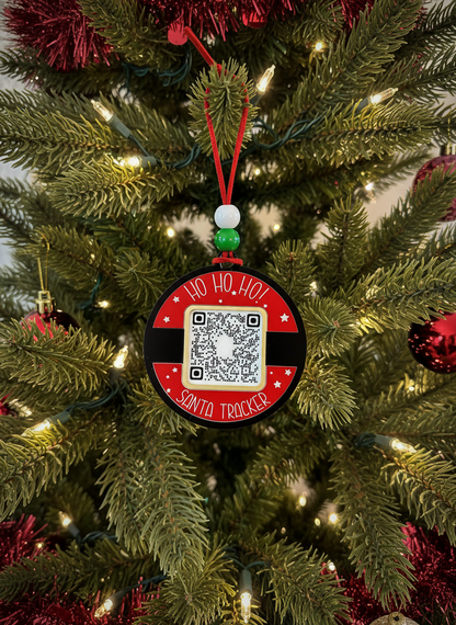Santa Tracker QR code ornament hanging on a decorated Christmas tree