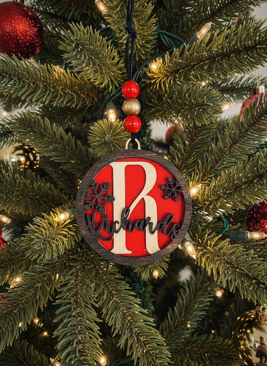 Personalized monogram snowflake ornament with 'R' and 'Richards' on Christmas tree