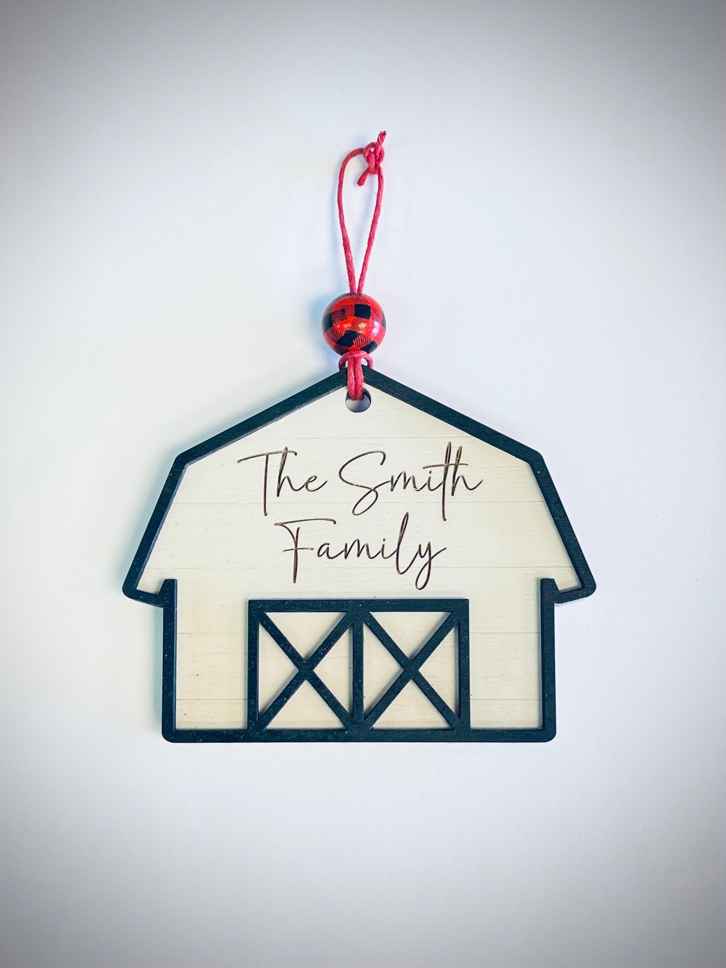 Farmhouse barn ornament with red plaid bead and custom family name