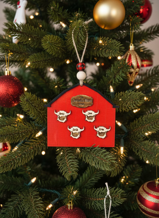 Highland cows barn ornament with names hanging on decorated Christmas tree