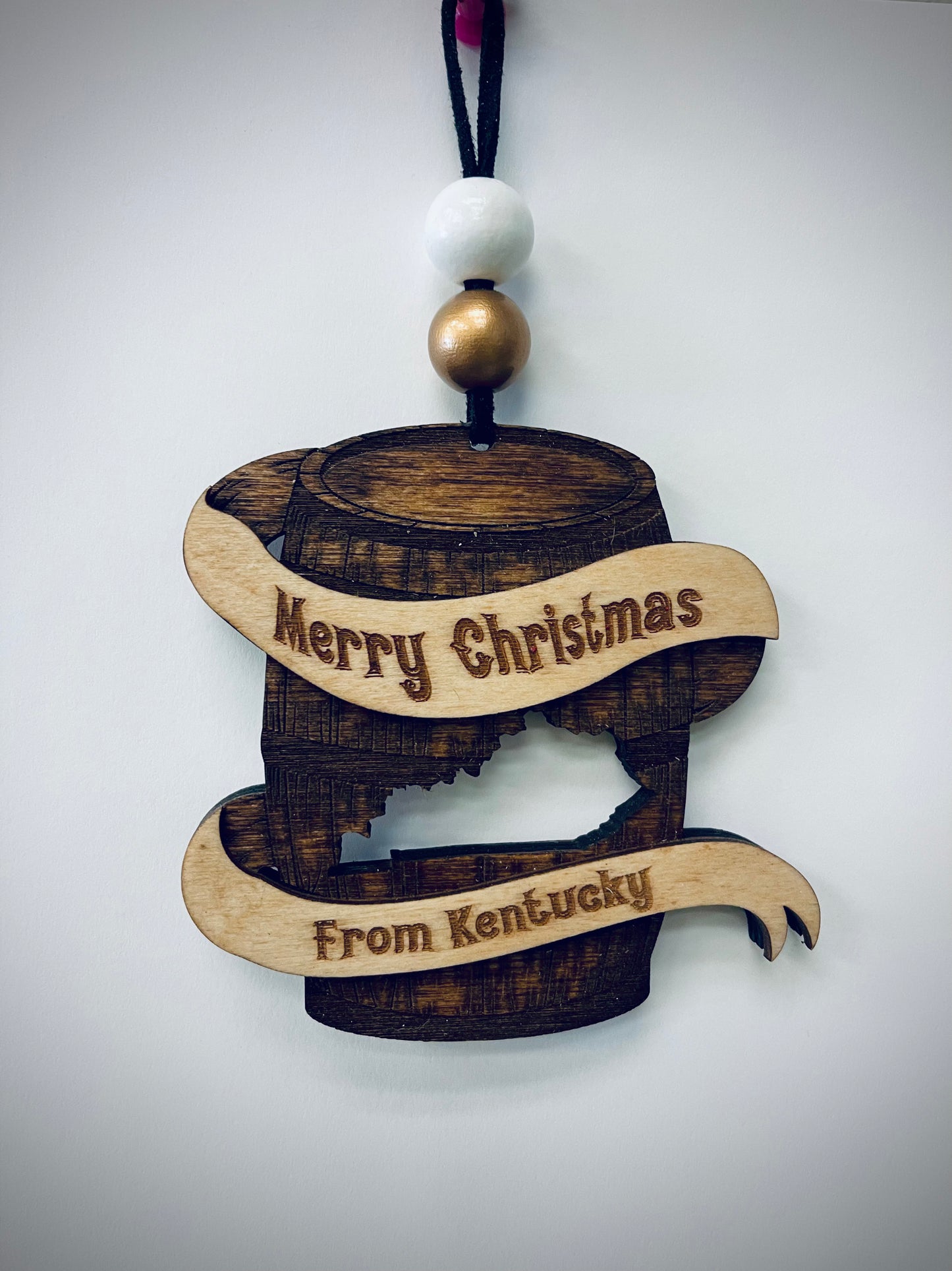 Wooden Kentucky bourbon barrel Christmas ornament with engraved Merry Christmas text