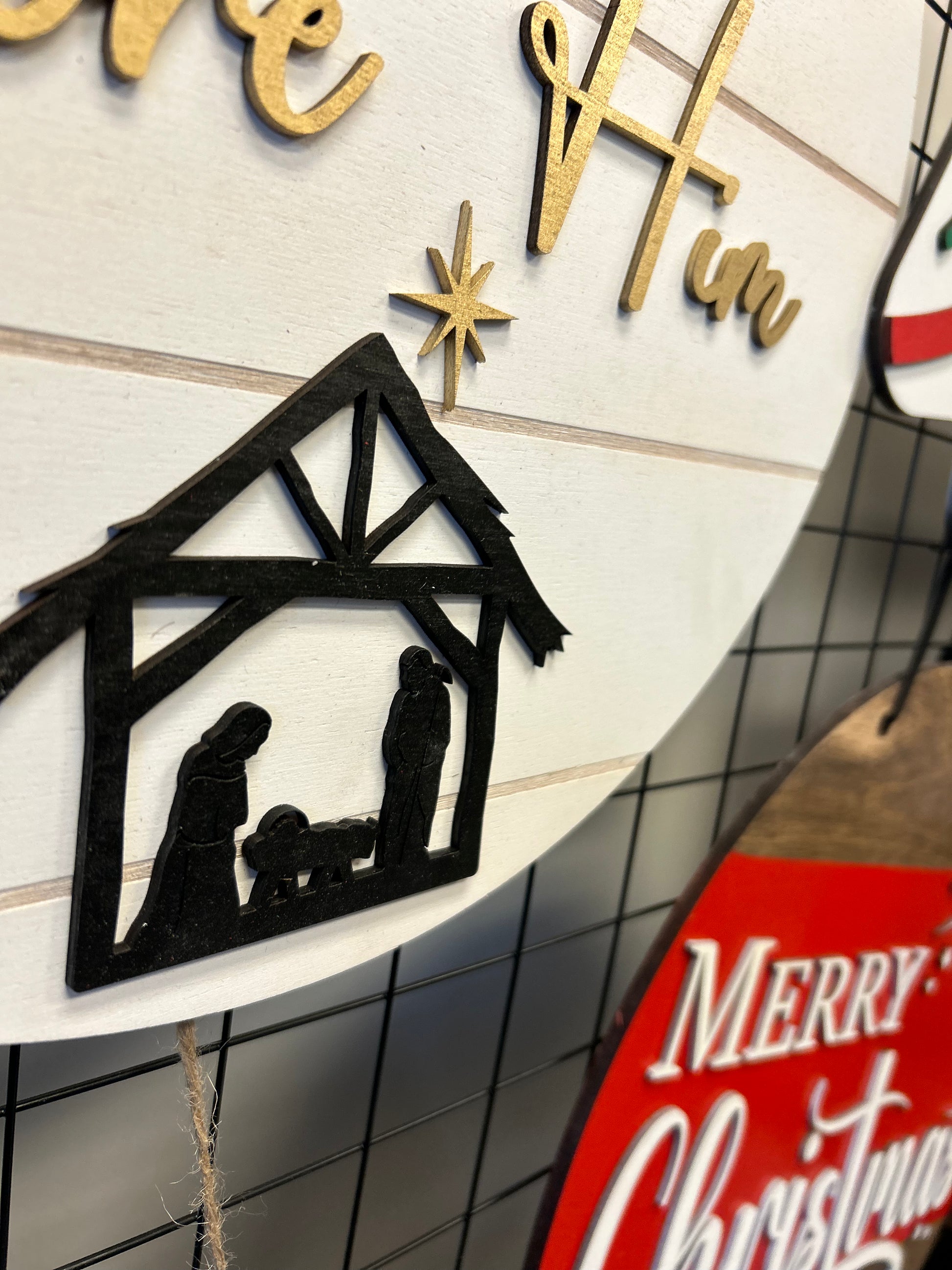 Oh Come Let Us Adore Him door hanger with nativity scene and gold lettering