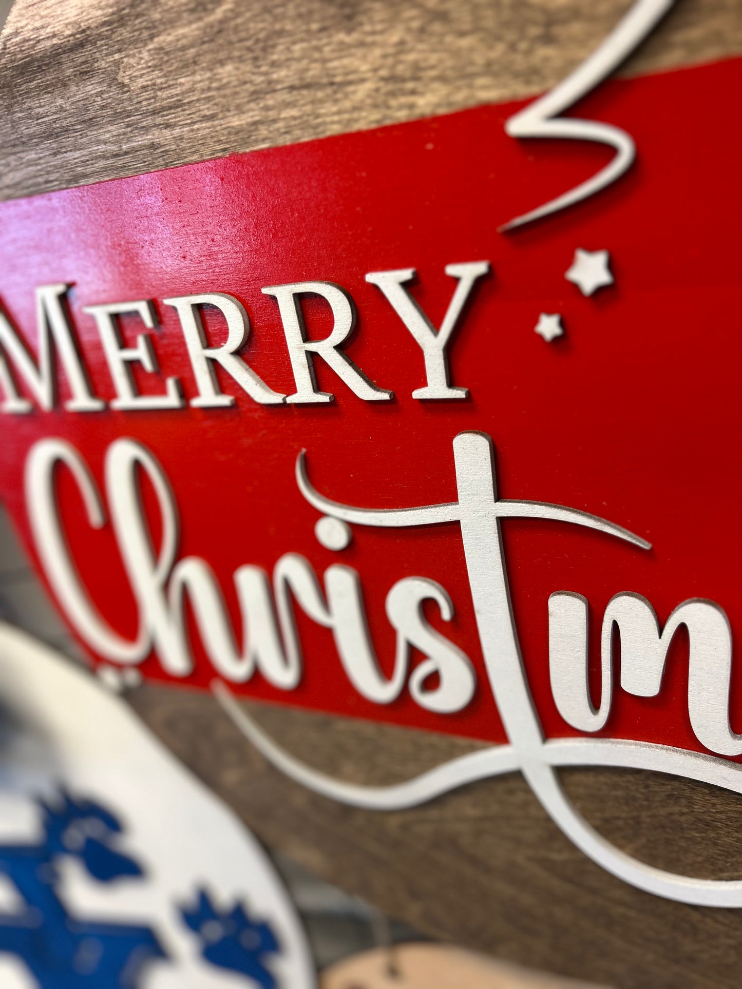 Merry Christmas wooden door hanger with red and white festive lettering