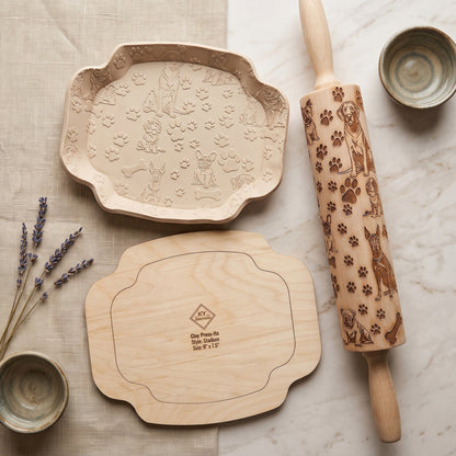 Custom engraved dog-themed rolling pin and clay press set with paw prints and breeds